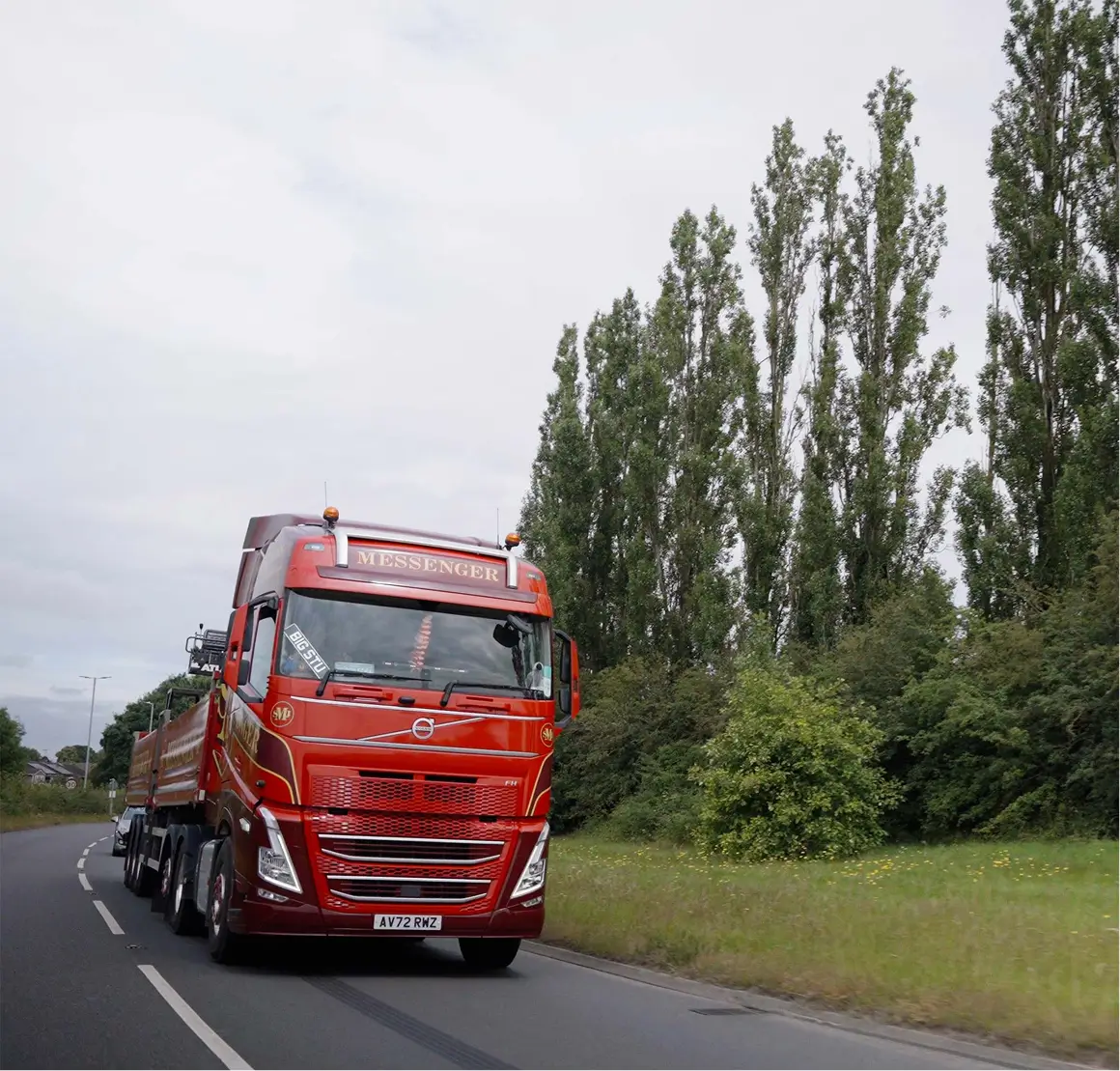 SJ Messenger lorry driving with trees