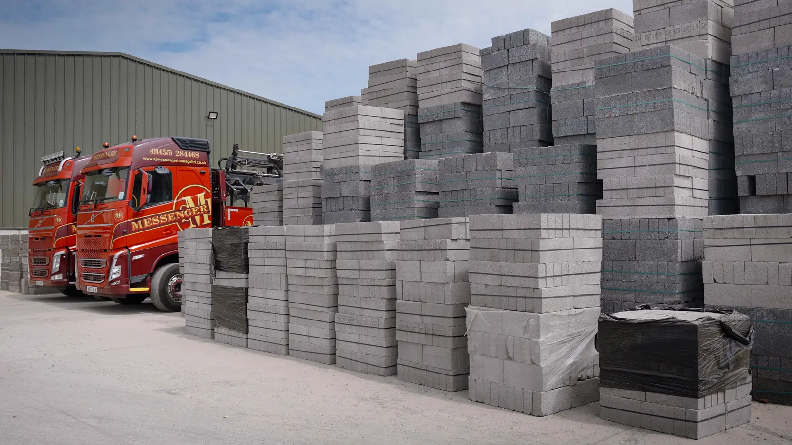 Lorries with brick blocks next to it