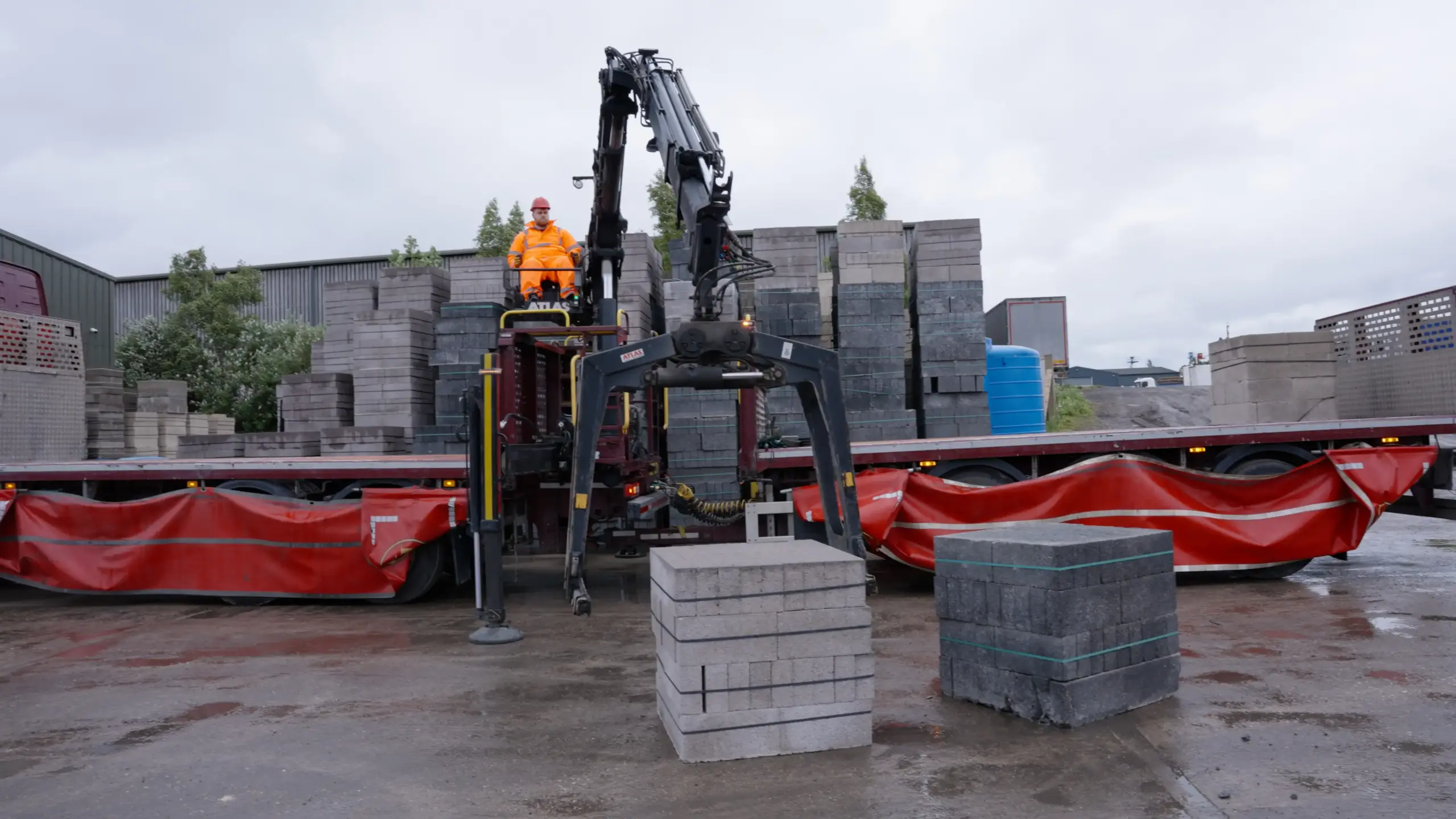 Man loading a lorry with bricks