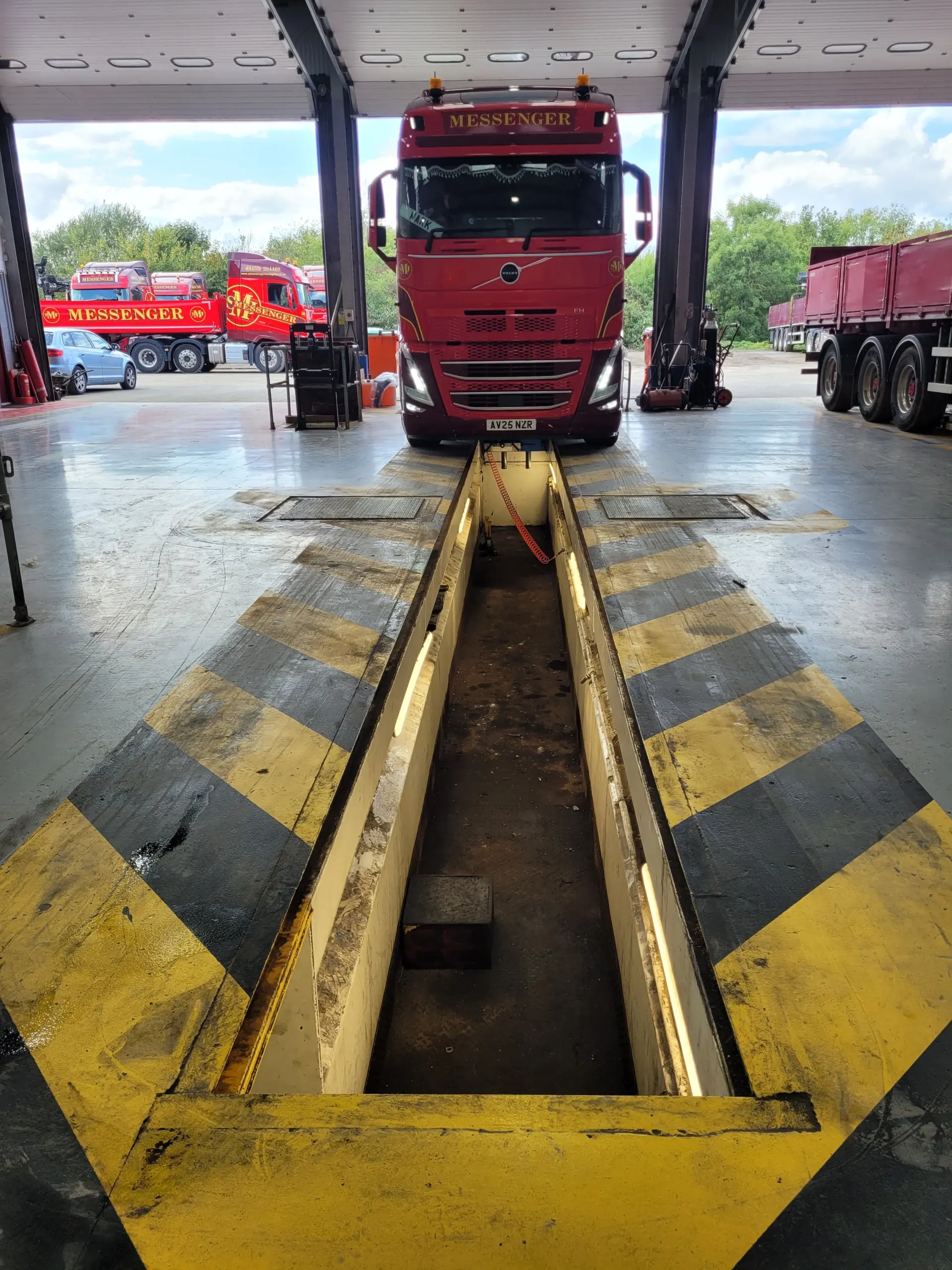 Lorry driving into a servicing garage